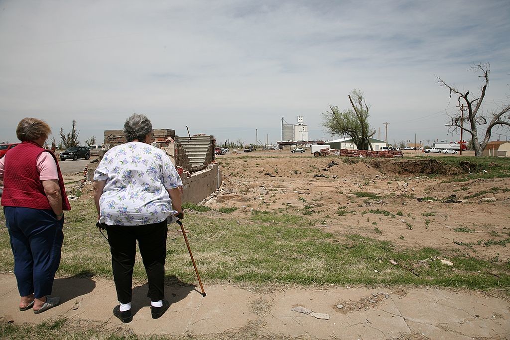 53. Women surveying destroyed church, Greensburg, Kansas IMG