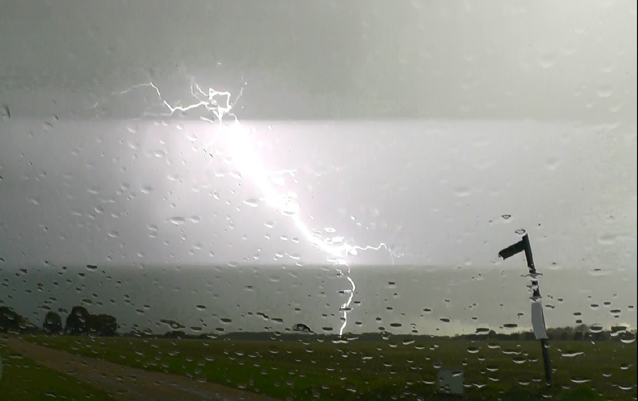 CG Lightning from a weak thunderstorm that passed by, giving heavy rain with hail mixed in.