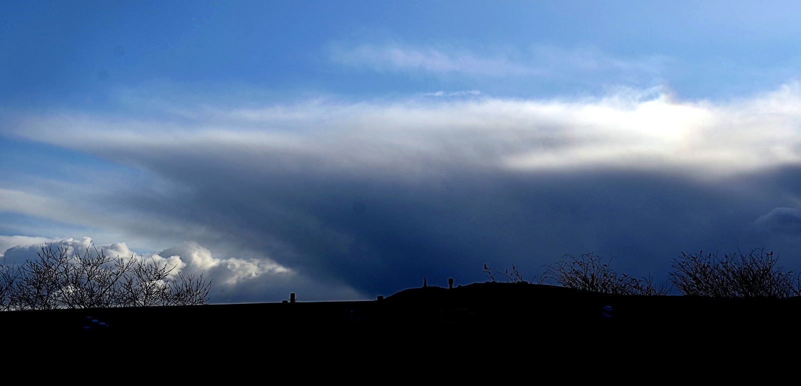 Eary morning - Cumulonimbus over Carn Brea, Redruth